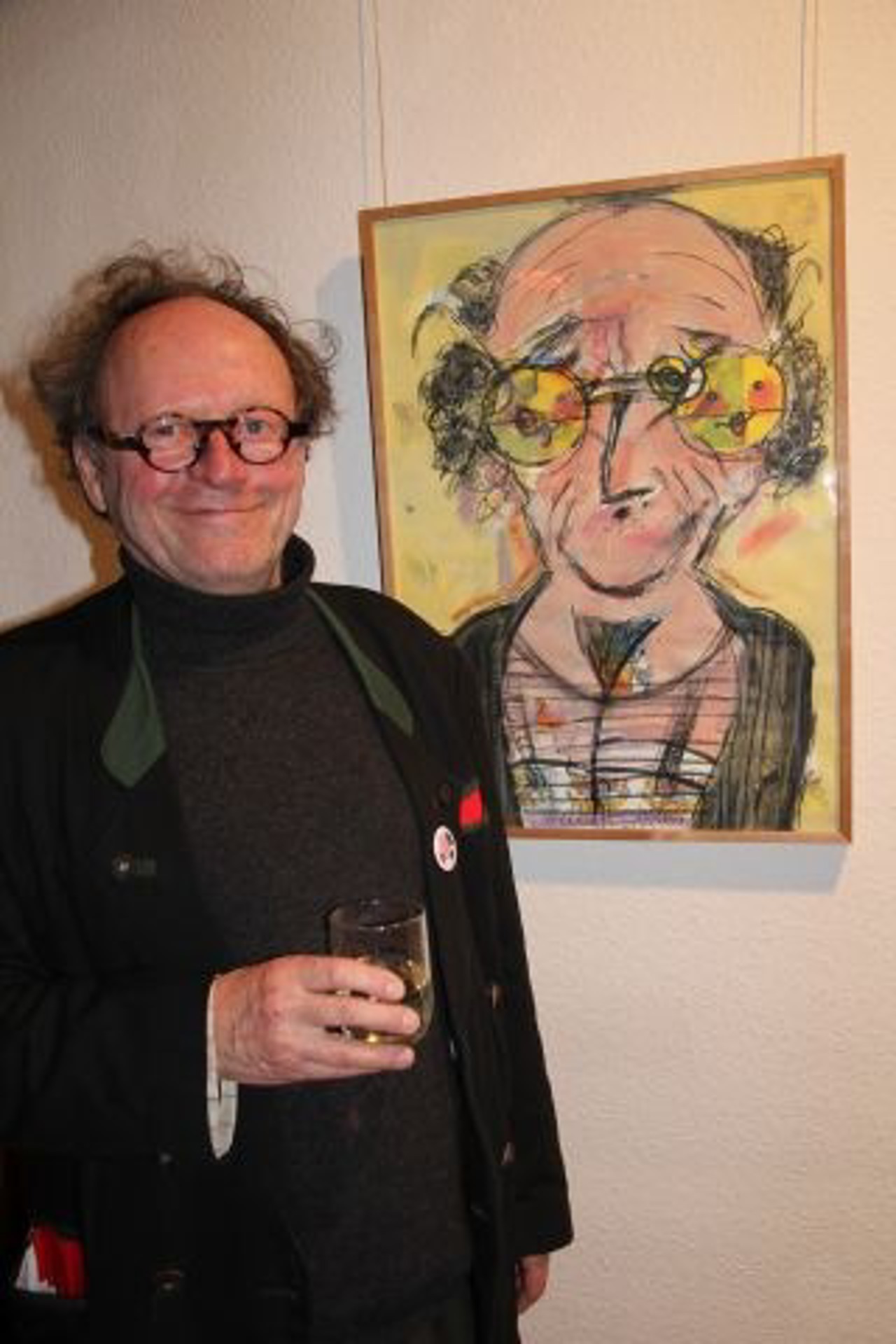 Feliks Büttner neben seinem Bild "Selbst"